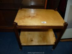 A small tea trolley with removable trays.