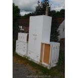 A white four piece bedroom set.