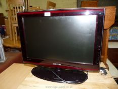 A Samsung 22" flat screen TV with remote.