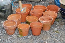 Twelve terracotta pots.