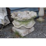 A shaped concrete planter with rope decoration, (separate base), 15" high x 19" diameter.