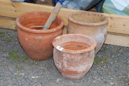 Three terracotta pots.