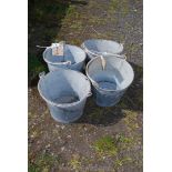 Four galvanised buckets.