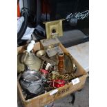 A box of miscellanea including brass, doll's house fireplace, candlesticks, cutlery etc.