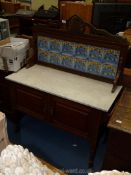 A Mahogany marble top Washstand with tiled splash back with art nouveau featuring stylised flower