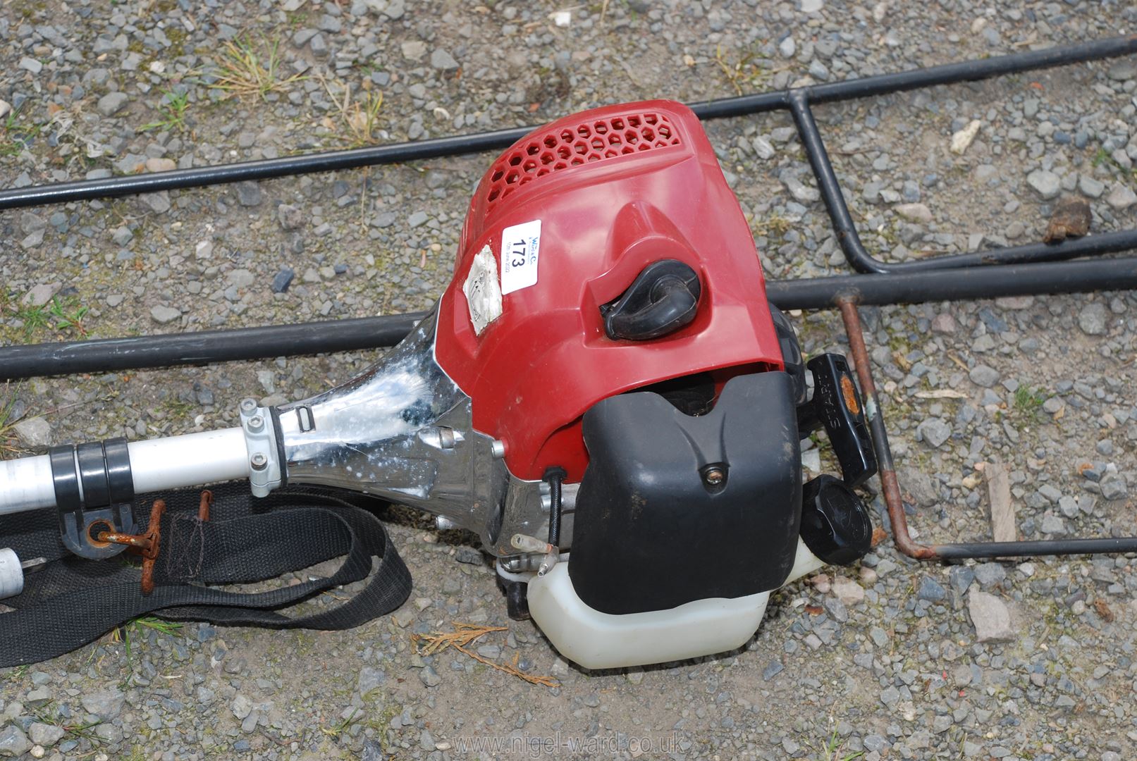 A Petrol Strimmer in running order with extra head. - Image 2 of 3