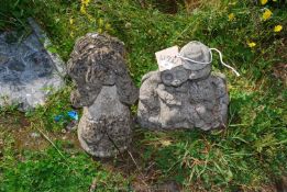 Two garden ornaments - hedgehogs and a child.