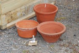 Three terracotta pots.