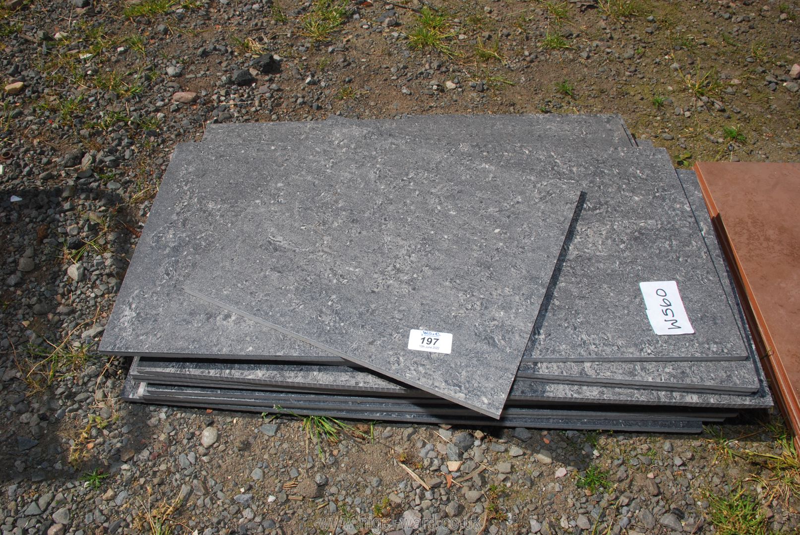 A quantity of grey glass tiles - polished stone effect.