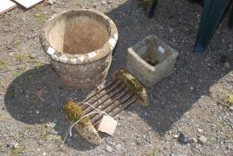 A round concrete planter, small square planter and a double boot scraper.