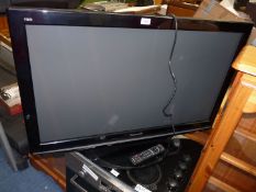 A 'Panasonic' 42" flat screen TV with remote.