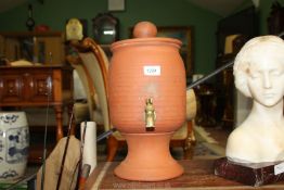 A terracotta drinks urn with lid and on a stand, 16 1/2'' tall.