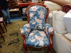 A circa 1900 Mahogany framed button backed Armchair having scroll detailed arms and front legs and