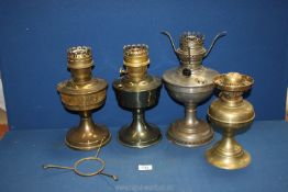 Four oil lamps,no shades or chimneys.