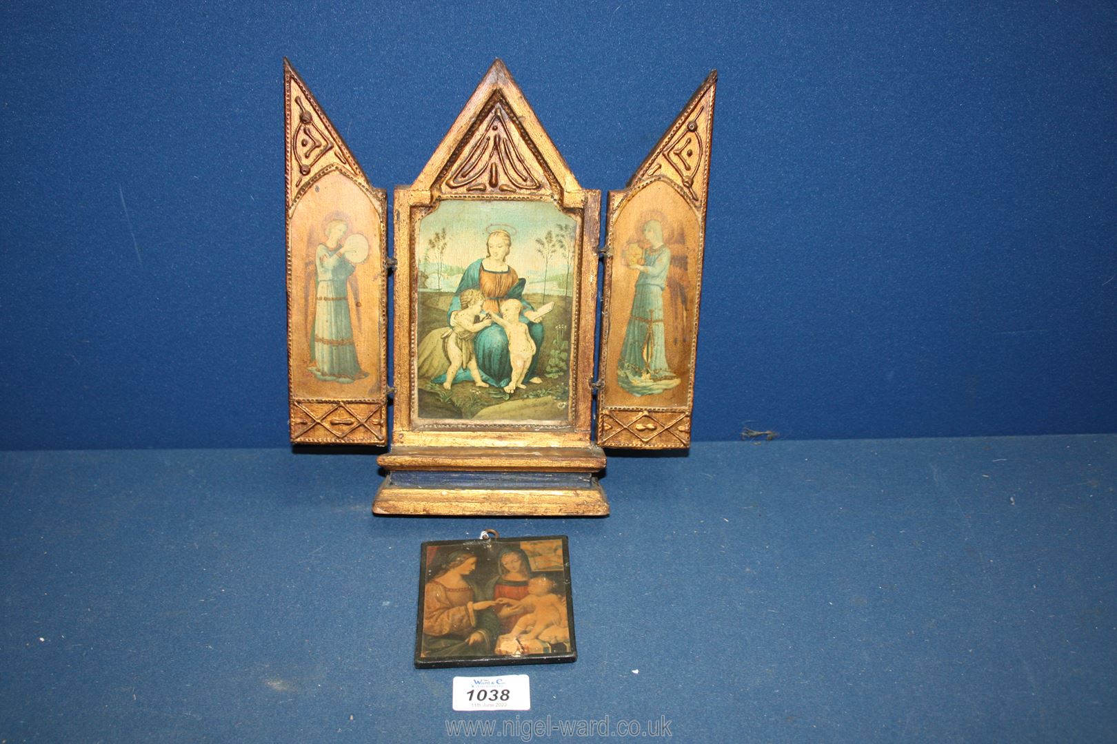 A gilded wood Tryptic with printed scenes depicting religious figures with angels on the outer