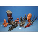 Miscellaneous African Folk Art carvings including a pair of black Egyptian style stone cats etc.