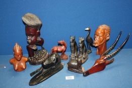 Miscellaneous African Folk Art carvings including a pair of black Egyptian style stone cats etc.