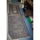Two small blue Rugs, bordered, patterned and fringed, some wear, 58'' x 30'' and 37'' x 35''.