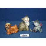 A small grey and white Beswick cat, West German kitten and Goebel Yorkshire Terrier with green bow.