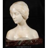 A superb Bust of a young lady in pensive pose, her plaited hair arranged as a band over her brow,