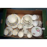 A yellow and blue Teaset including cake plates, side plates and cups/saucers,