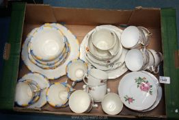 A yellow and blue Teaset including cake plates, side plates and cups/saucers,
