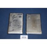 Two cigarette cases, one being foreign made with engraving of the U.K.