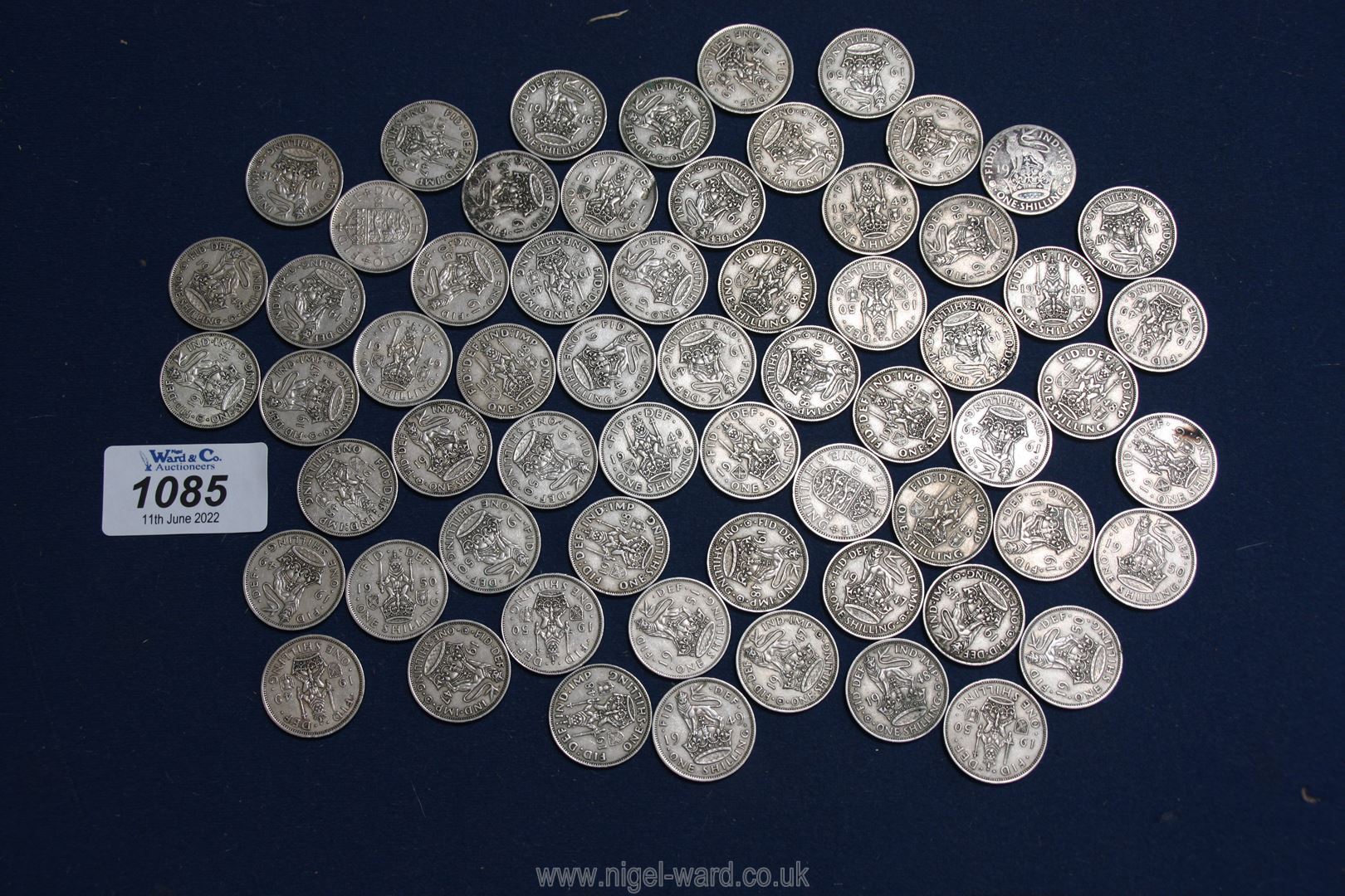 A good quantity of George VI shillings.