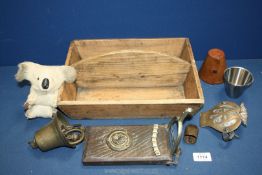 An old wooden cutlery box, AA badge, hanging door bell, small Koala bear,