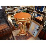 An elegant and decorative circular Urn Stand/Table having a tassel and swag frieze,