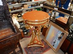 An elegant and decorative circular Urn Stand/Table having a tassel and swag frieze,