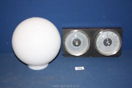 A weather station white and milk glass globe Lampshade.