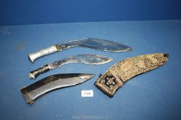 Two ceremonial style daggers marked 'India' to the elaborately decorated blades,