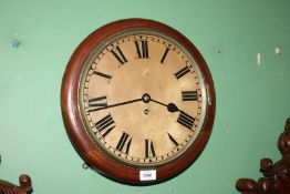 A dark Oak circular wall clock having a fusee movement with Roman numerals to the face.