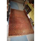 A terracotta and black ground bordered, patterned and fringed Rug, 79'' x 50''.