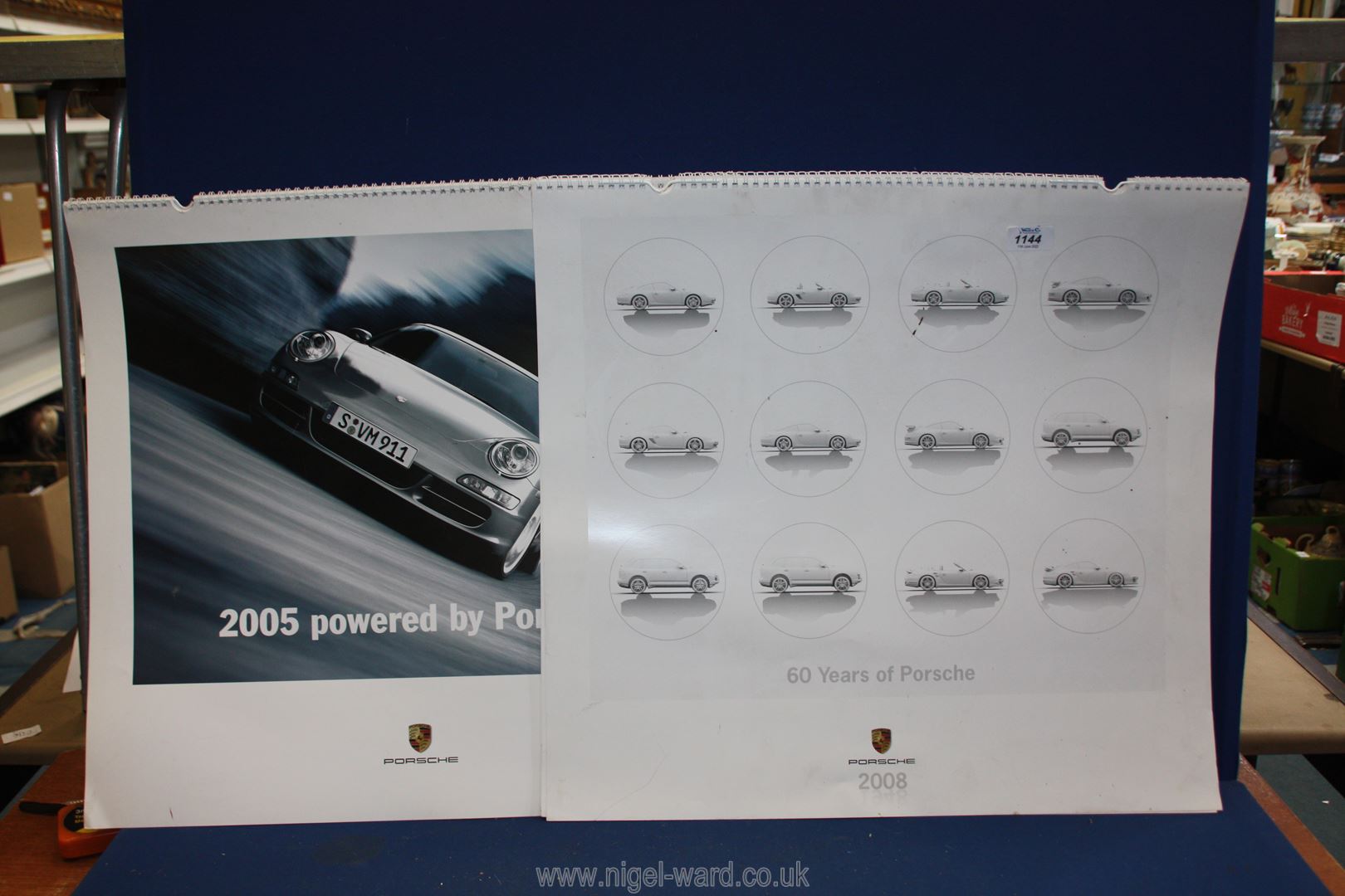 Two Porsche calendars dated 2005 and 2008.
