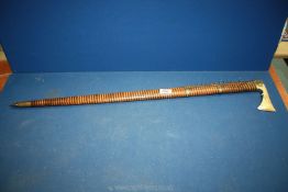 An unusual Walking Stick with brass axe head handle and tip ending in a white metal spike,