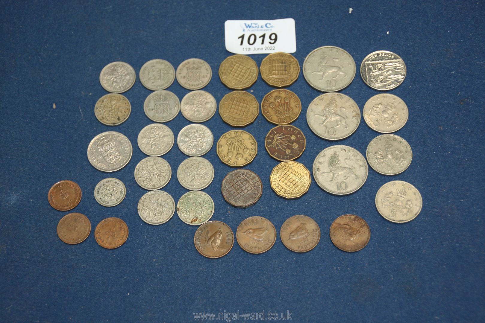 A small quantity of coins including silver sixpences, halfpennies, farthings, threepenny bits etc.