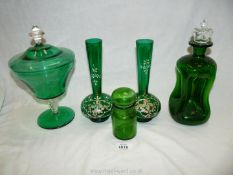 Five pieces of green glass including a pair of Mary Gregory style vases, dimple decanter,