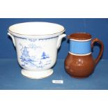 A brown pottery Jug, 6'' tall and a Royal Winton blue and white Ice Bucket, 7'' tall.