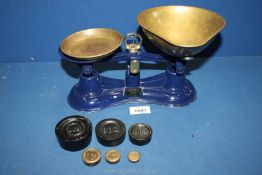 A set of Salters scales and weights, 10 1/2" wide.