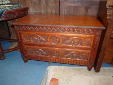 A low Mahogany Chest of two long Drawers,