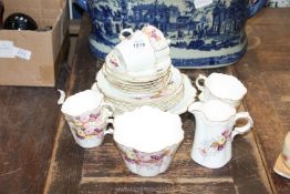 A very pretty bone china part Teaset marked with entwined initials C and F to base and pattern no