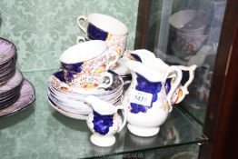 A small quantity of Gaudy Welsh china in Tulip design: four cups and saucers,