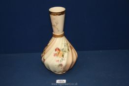 A Royal Worcester blush ivory bottle Vase with twist fluted body and banded gilt neck with all-over