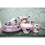 A quantity of Gaudy Welsh china in Oyster design: two cake plates, three cups,