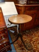 A circular Oak topped occasional Table standing on a slender turned pillar and three swept legs,