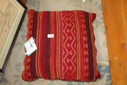 A rare Timor Biboki cushion made from hand woven cotton in terracotta shades, 20'' square.