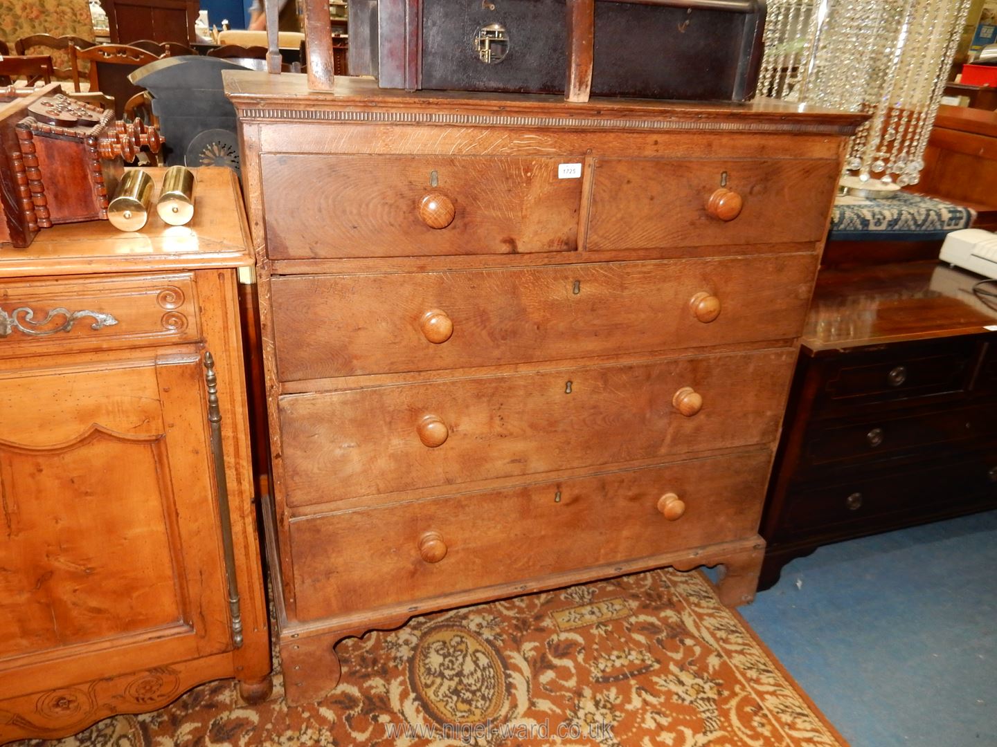 A mixed woods including Oak Chest of three long and two short Drawers having turned wood knobs and