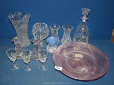 A quantity of glass including vases, decanter, candlesticks, pink swirl bowl, and blue bud vase.